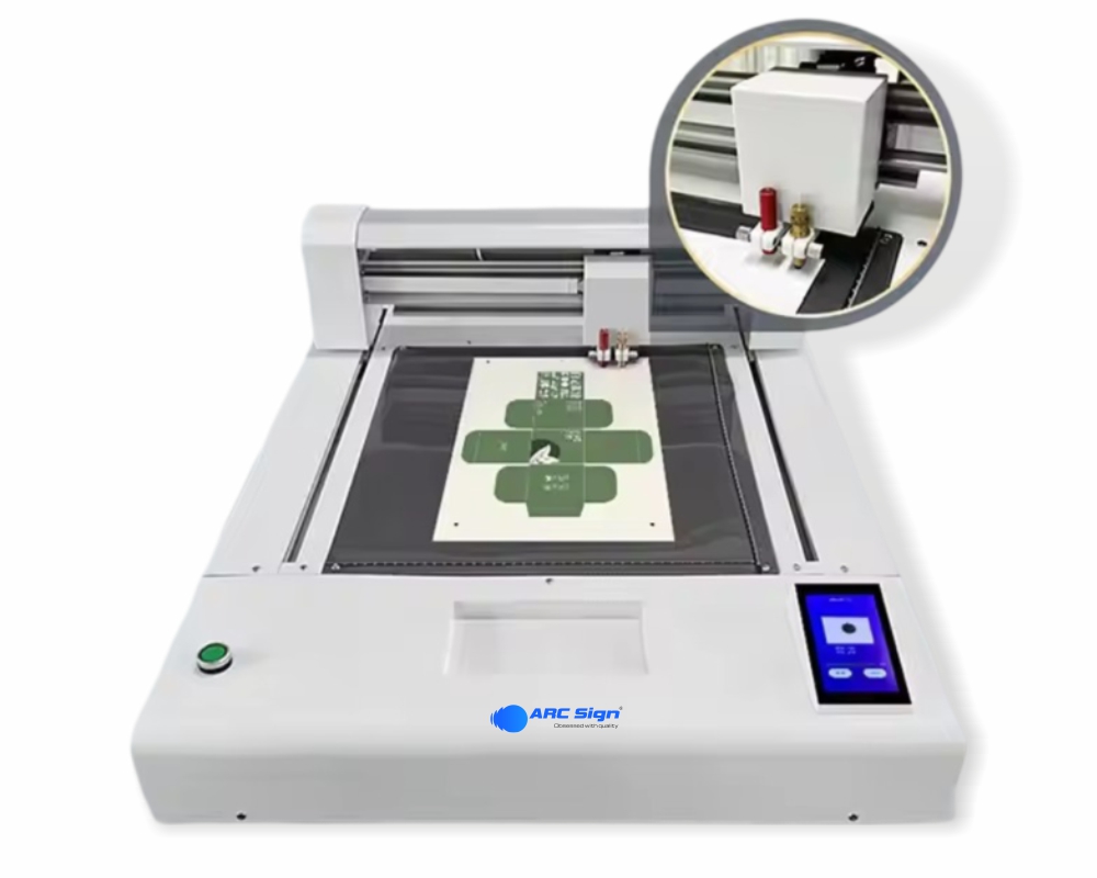 High-precision No.1 flatbed cutting plotter machine with touchscreen display and dual cutting heads for cardboard and packaging design.